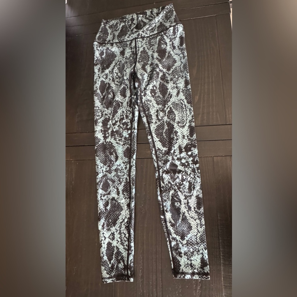 Carbon38 small teal snake print leggings.